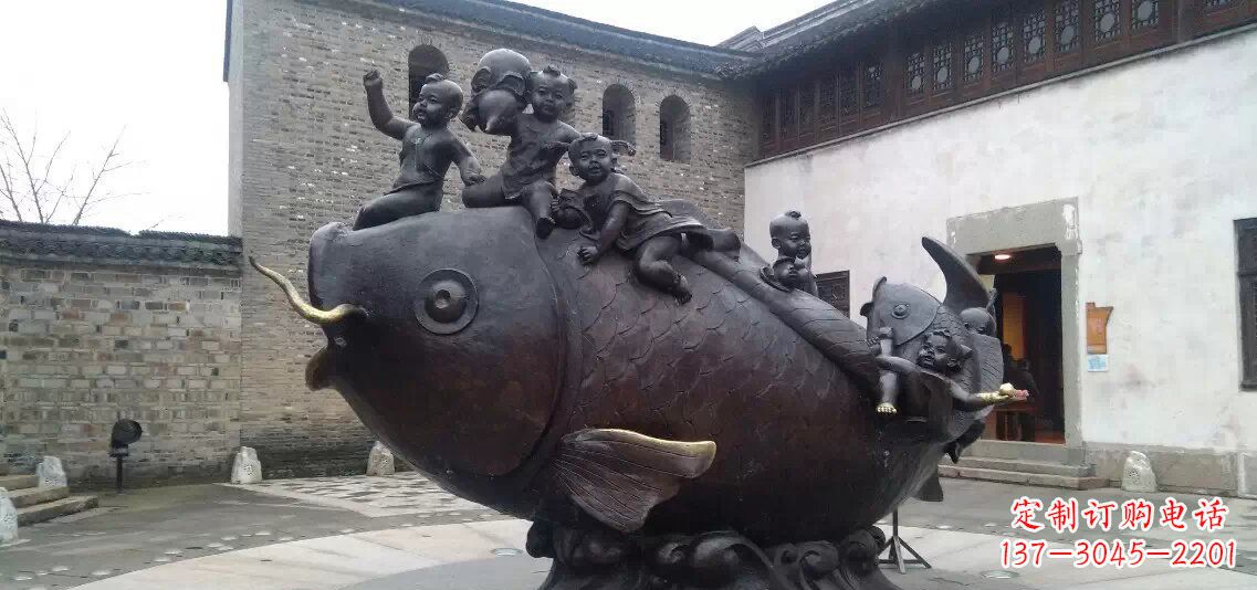 酒泉小孩骑鱼铜雕